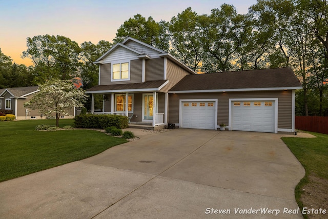 2567 Chippewa Trl, Muskegon, MI 49445 - traditional-style home with concrete driveway, an attached garage, and covered porch