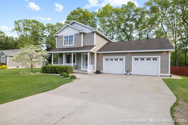 2567 Chippewa Trl, Muskegon, MI 49445 - traditional-style home with an attached garage, driveway, and a porch