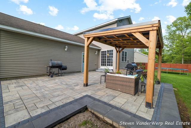 2567 Chippewa Trl, Muskegon, MI 49445 - view of patio / terrace with a trampoline and a grill