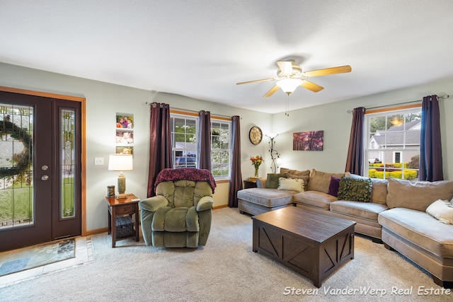2567 Chippewa Trl, Muskegon, MI 49445 - living room featuring a ceiling fan, light colored carpet, and baseboards