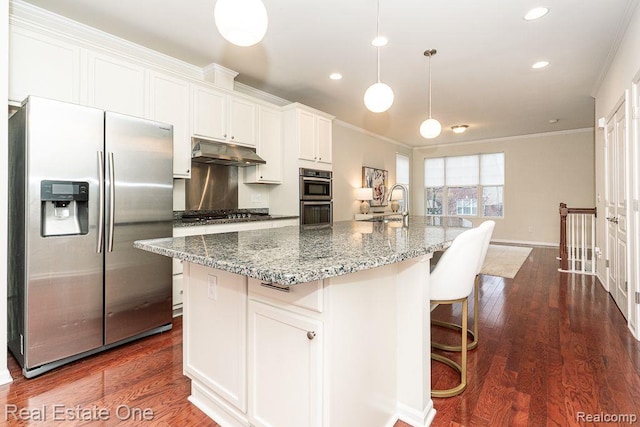 2669 Helmsdale Cir, Rochester, MI 48307 - kitchen with appliances with stainless steel finishes, under cabinet range hood, ornamental molding, white cabinetry, and a center island with sink