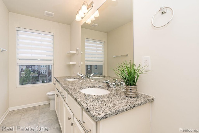 2669 Helmsdale Cir, Rochester, MI 48307 - full bathroom featuring baseboards, double vanity, toilet, and tile patterned floors