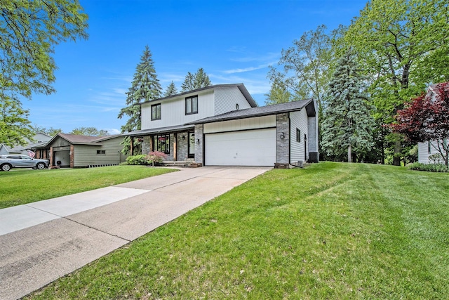 3025 Juneberry Ave SE, Grand Rapids, MI 49508 - traditional-style house featuring a garage, a front lawn, concrete driveway, brick siding, and covered porch
