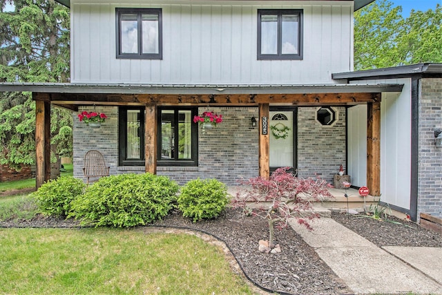 3025 Juneberry Ave SE, Grand Rapids, MI 49508 - view of front of property featuring brick siding and a porch