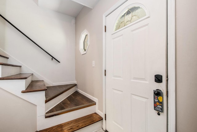 3025 Juneberry Ave SE, Grand Rapids, MI 49508 - foyer entrance featuring stairs, baseboards, and wood finished floors