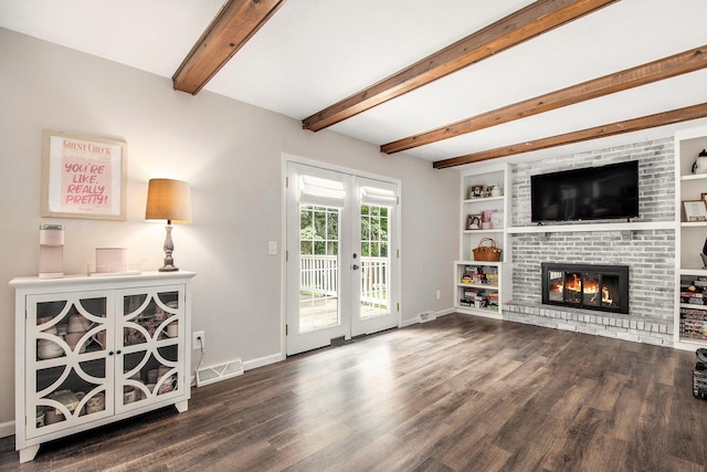 3025 Juneberry Ave SE, Grand Rapids, MI 49508 - unfurnished living room featuring wood finished floors, baseboards, beamed ceiling, french doors, and a fireplace