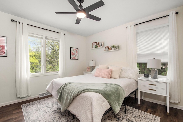 3025 Juneberry Ave SE, Grand Rapids, MI 49508 - bedroom featuring dark wood-style flooring, baseboards, and ceiling fan