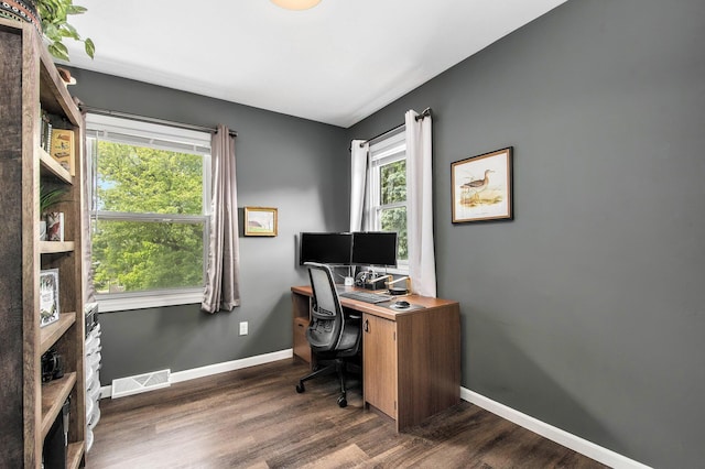 3025 Juneberry Ave SE, Grand Rapids, MI 49508 - home office with plenty of natural light, dark wood finished floors, and baseboards