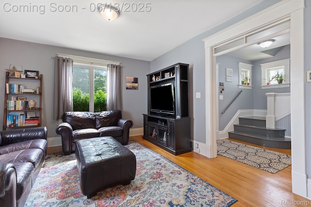 1 Jones St, Yale, MI 48097 - living room with wood finished floors, stairway, and baseboards