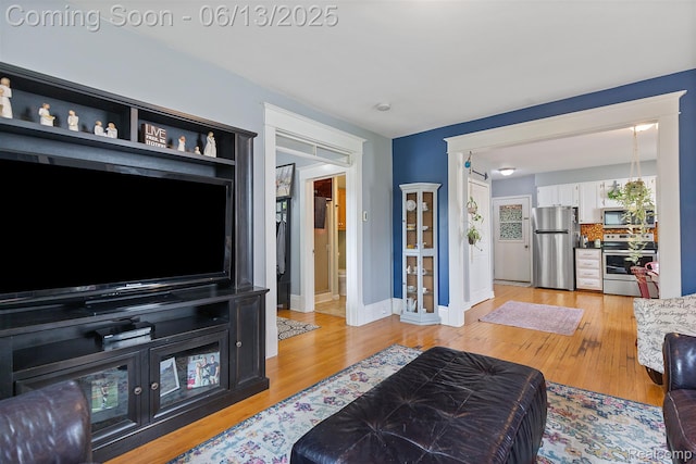 1 Jones St, Yale, MI 48097 - living room featuring light wood-type flooring and baseboards