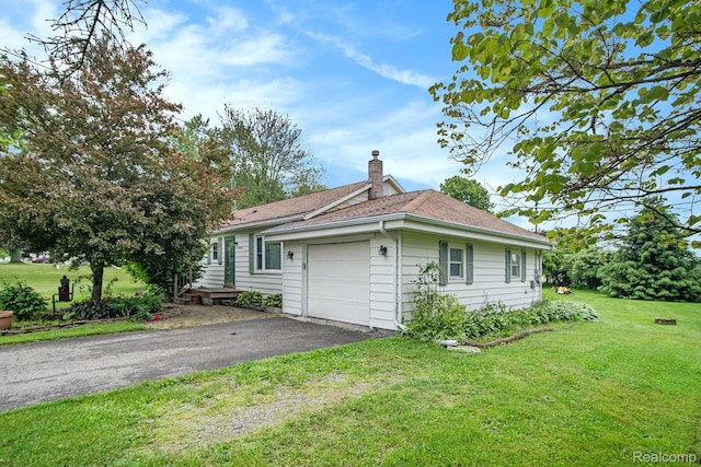 613 Genesee Ave, Gaines, MI 48436 - view of home's exterior featuring a chimney, an attached garage, a yard, driveway, and roof with shingles