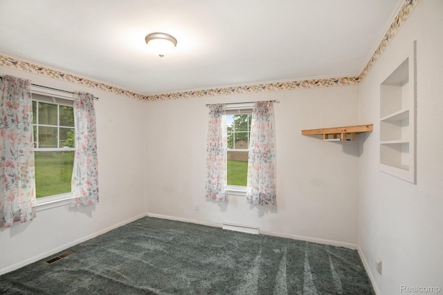 613 Genesee Ave, Gaines, MI 48436 - spare room featuring carpet, baseboard heating, and baseboards