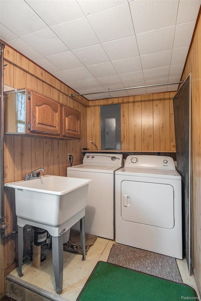 613 Genesee Ave, Gaines, MI 48436 - laundry area featuring wood walls, electric panel, and washer and clothes dryer