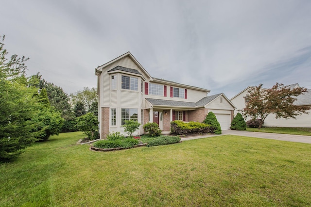 324 Redrock Ct, Ann Arbor, MI 48103 - traditional-style house featuring driveway, a garage, brick siding, and a front lawn