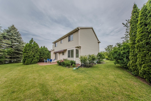 324 Redrock Ct, Ann Arbor, MI 48103 - back of property with a patio and a lawn