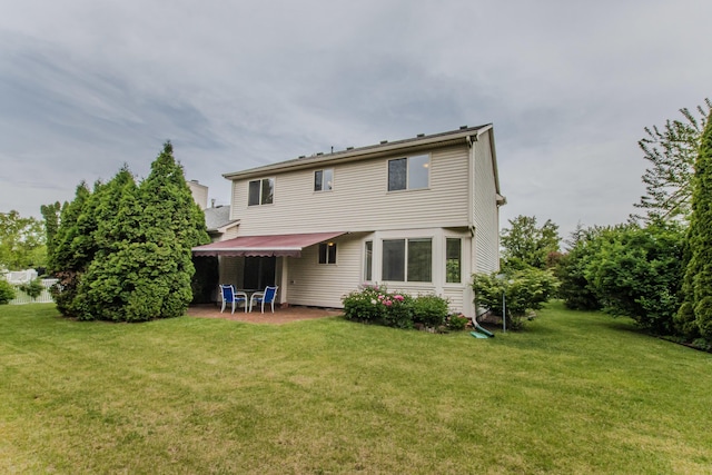 324 Redrock Ct, Ann Arbor, MI 48103 - back of property featuring a yard and a patio