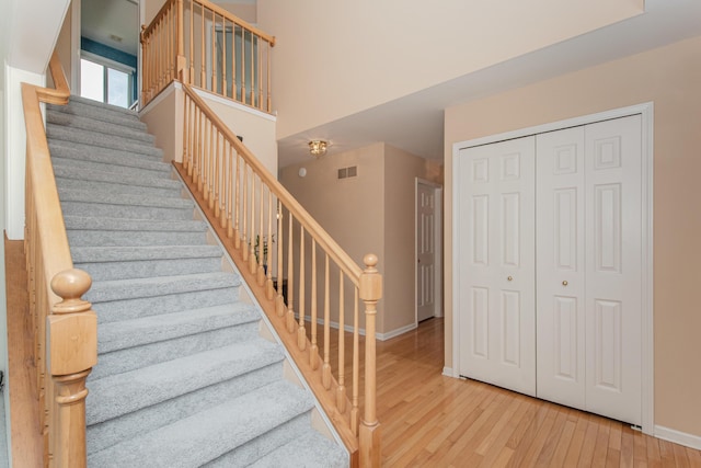 324 Redrock Ct, Ann Arbor, MI 48103 - stairs with hardwood / wood-style floors and baseboards