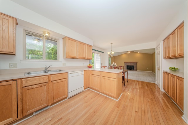324 Redrock Ct, Ann Arbor, MI 48103 - kitchen featuring white dishwasher, a sink, open floor plan, light wood-style flooring, and a peninsula
