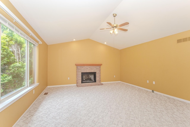 324 Redrock Ct, Ann Arbor, MI 48103 - unfurnished living room featuring a ceiling fan, healthy amount of natural light, lofted ceiling, carpet flooring, and a fireplace