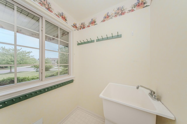324 Redrock Ct, Ann Arbor, MI 48103 - washroom featuring baseboards, tile patterned floors, and a sink
