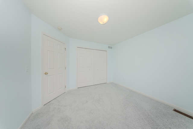 324 Redrock Ct, Ann Arbor, MI 48103 - unfurnished bedroom with carpet flooring, baseboards, and a closet