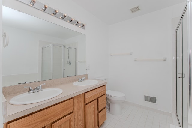 324 Redrock Ct, Ann Arbor, MI 48103 - full bath featuring double vanity, a shower stall, tile patterned floors, and toilet