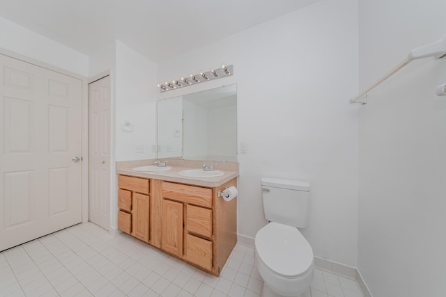 324 Redrock Ct, Ann Arbor, MI 48103 - full bath featuring double vanity, toilet, and tile patterned floors