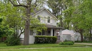 1433 Main St, Saint Joseph, MI 49085 - view of front facade featuring a front lawn and covered porch