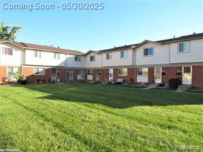 20938 Hunt Dr Unit 52, Roseville, MI 48066 - rear view of property featuring a lawn