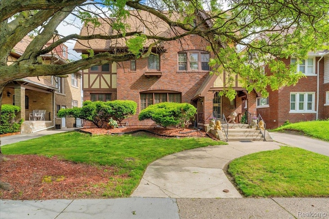 2505 Chicago Blvd, Detroit, MI 48206 - view of front of property with brick siding and a front lawn