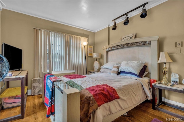 2505 Chicago Blvd, Detroit, MI 48206 - bedroom with crown molding and wood finished floors
