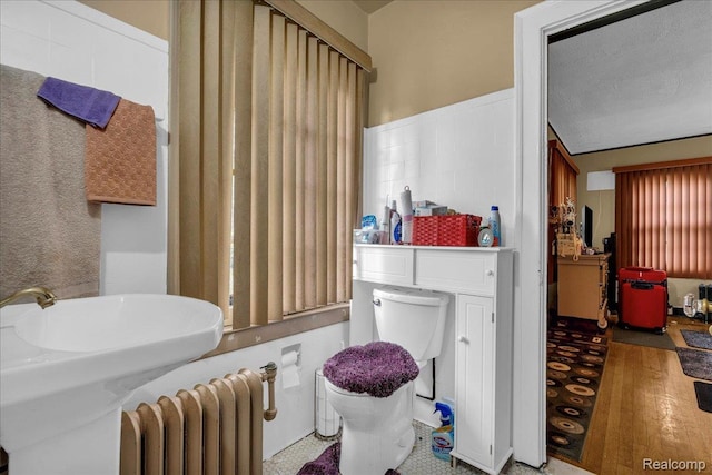 2505 Chicago Blvd, Detroit, MI 48206 - full bath featuring radiator, toilet, a shower, and a sink