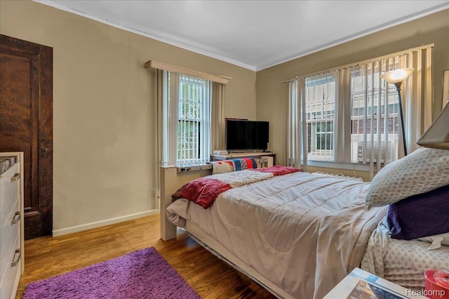 2505 Chicago Blvd, Detroit, MI 48206 - bedroom with wood finished floors, ornamental molding, and baseboards