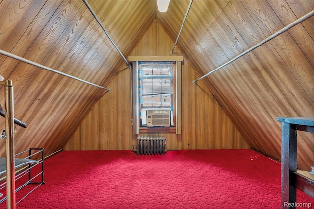 2505 Chicago Blvd, Detroit, MI 48206 - additional living space with radiator heating unit, cooling unit, lofted ceiling, carpet flooring, and wood walls