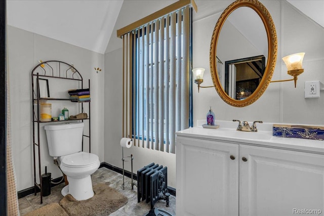 2505 Chicago Blvd, Detroit, MI 48206 - bathroom featuring radiator, toilet, vanity, lofted ceiling, and baseboards