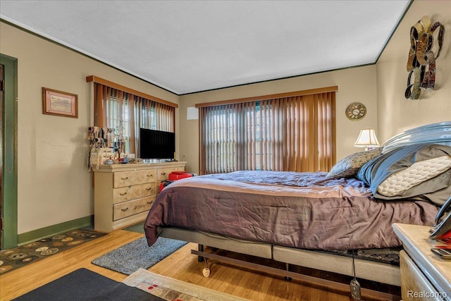 2505 Chicago Blvd, Detroit, MI 48206 - bedroom featuring wood finished floors and baseboards