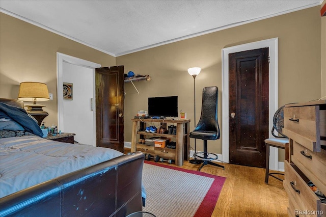 2505 Chicago Blvd, Detroit, MI 48206 - bedroom featuring wood finished floors and crown molding
