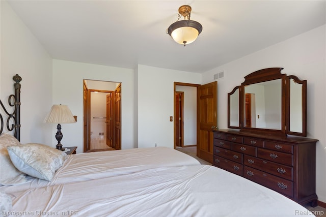 15380 Windmill Cir, Macomb, MI 48044 - bedroom featuring baseboards and connected bathroom