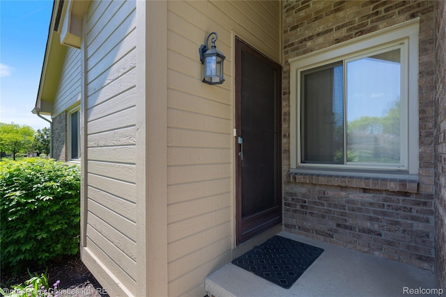 15380 Windmill Cir, Macomb, MI 48044 - property entrance featuring brick siding
