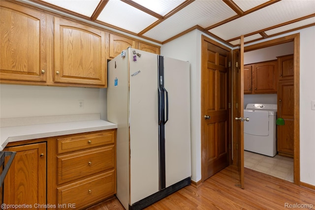 15380 Windmill Cir, Macomb, MI 48044 - kitchen featuring washer / clothes dryer, freestanding refrigerator, light countertops, light flooring, and brown cabinets