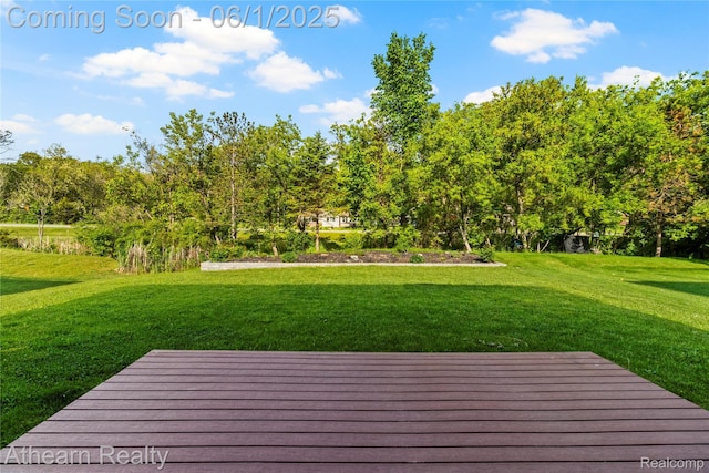 305 Beaver Run, Holly, MI 48442 - wooden deck with a lawn and view of scattered trees