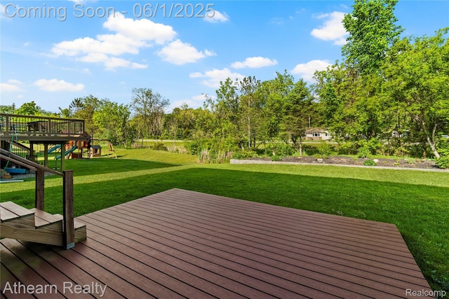 305 Beaver Run, Holly, MI 48442 - wooden terrace with a lawn and a playground