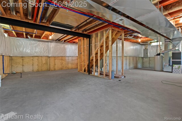305 Beaver Run, Holly, MI 48442 - unfinished below grade area featuring electric panel, gas water heater, and heating unit