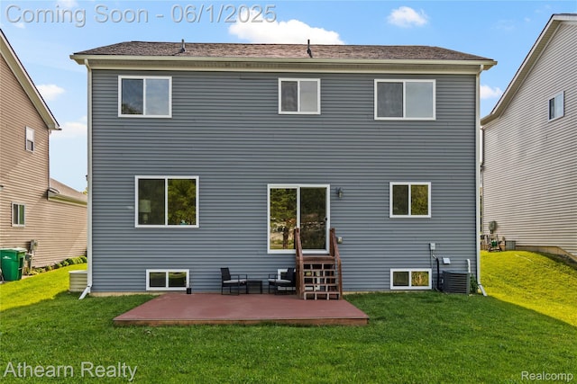 305 Beaver Run, Holly, MI 48442 - back of property featuring a yard, a patio area, and central AC unit