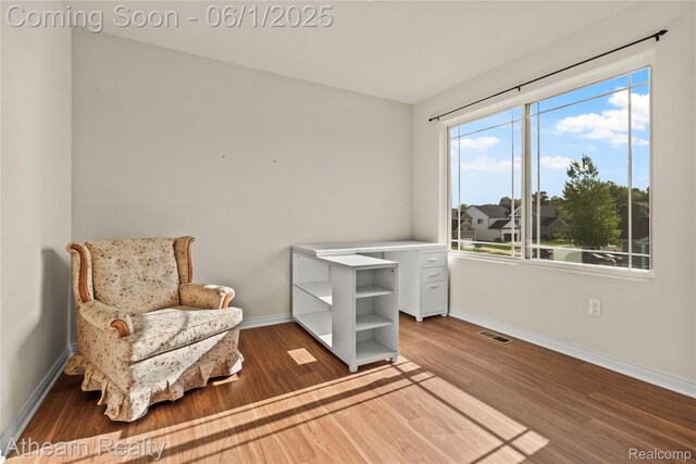 305 Beaver Run, Holly, MI 48442 - sitting room with wood finished floors and baseboards