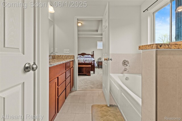 305 Beaver Run, Holly, MI 48442 - ensuite bathroom with a bath, plenty of natural light, vanity, and tile patterned floors
