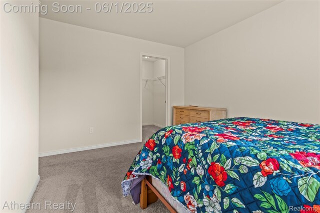 305 Beaver Run, Holly, MI 48442 - bedroom with carpet flooring, baseboards, and a spacious closet