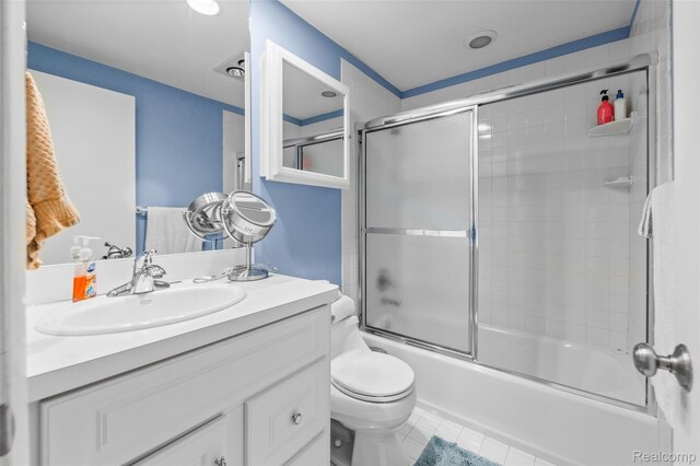 5138 Bayside Dr, Troy, MI 48098 - full bathroom featuring vanity, toilet, combined bath / shower with glass door, and tile patterned floors