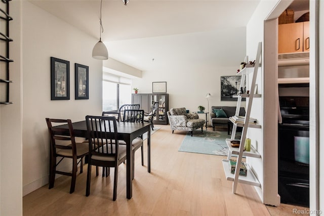 1001 W Jefferson Ave Unit 22H, Detroit, MI 48226 - dining area featuring light wood-type flooring