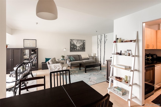 1001 W Jefferson Ave Unit 22H, Detroit, MI 48226 - dining space featuring light wood finished floors